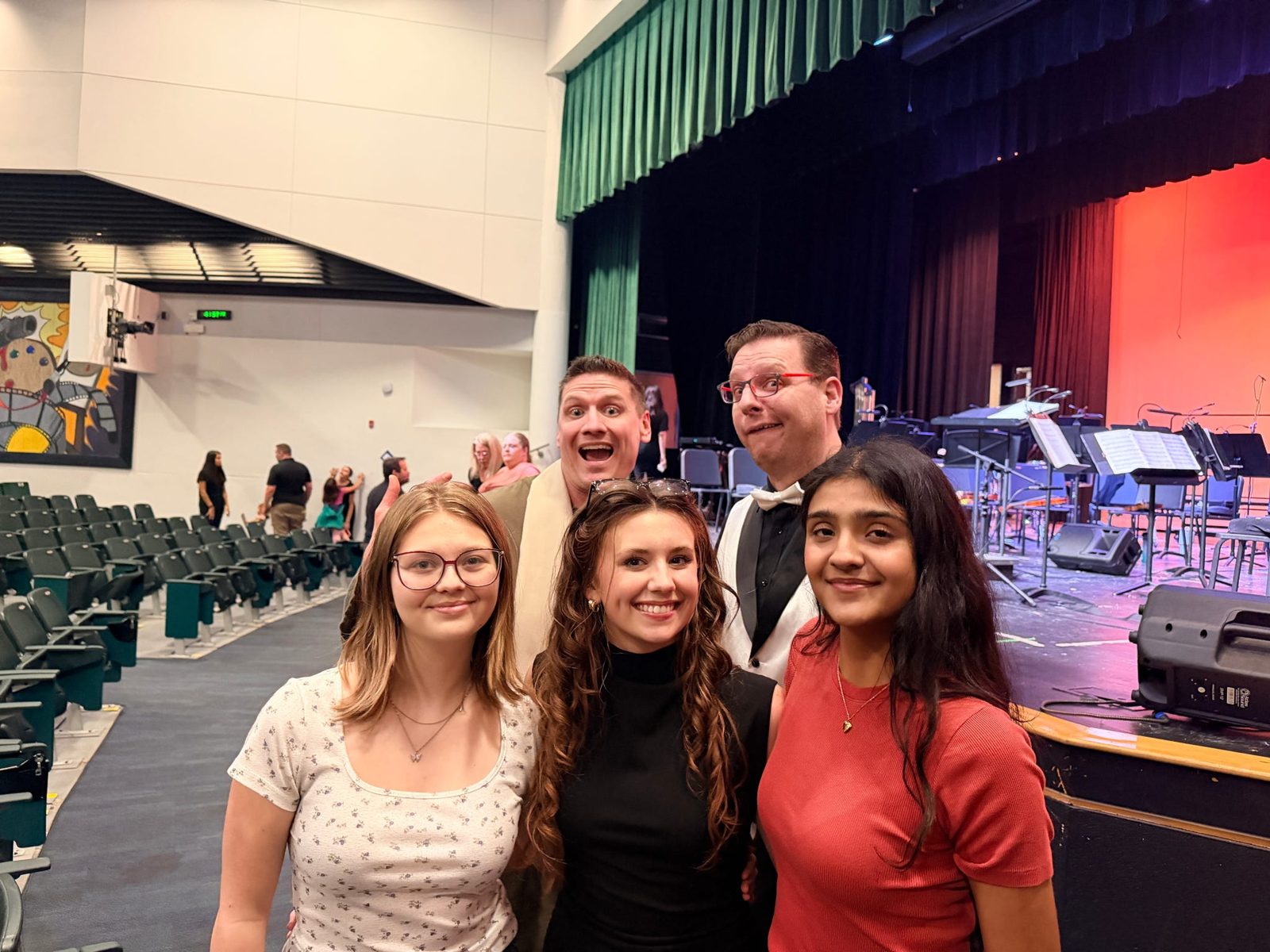 Performers and friends gathered in the auditorium before a show